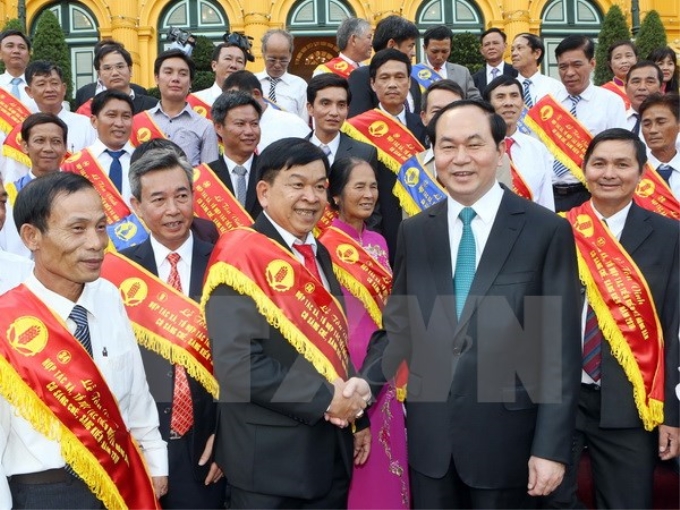 Chủ tịch nước Trần Đại Quang với các đại biểu tại buổi gặp mặt. (Ảnh: TTXVN)